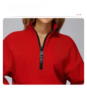 Detail of red stand collar sweatshirt with high-quality half-zip closure and windproof fabric