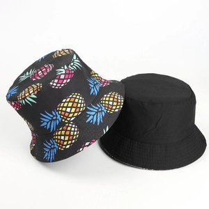 Double-sided tropical pineapple print and solid black reversible cotton bucket hat