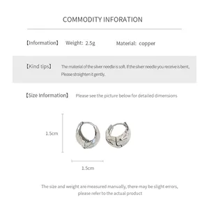 Detailed view of 1.5cm 14K gold plated snake hoop earrings with 2.5g copper and silver body