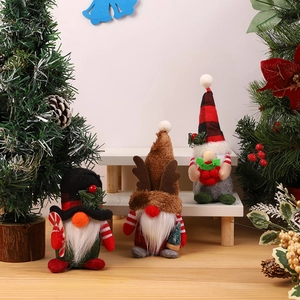 Three festive Christmas gnomes set with plaid hats, reindeer antlers and candy canes