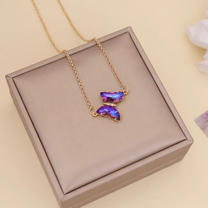 Chic golden butterfly pendant necklace with purple gradient wings and sparkling crystals