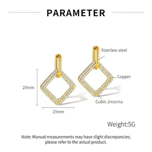 Detail of gold geometric diamond earrings with white zircon accents and size parameters