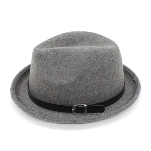Close-up of grey felt fedora featuring a black leather band and silver buckle detail