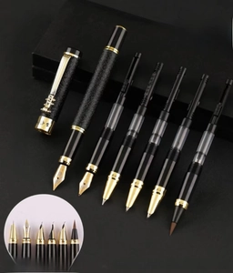 Detailed macro view of black and gold fountain pen nib set with various writing tips