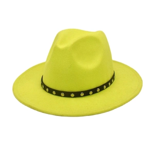 Detail of neon yellow wool fedora hat with black studded band and metal buckle accents