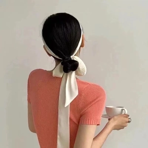 Elegant 2-meter pearl white satin silk scarf tied as a hair ribbon on a ponytail
