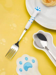 Detail of creative cat paw 304 stainless steel spoon and fork set with ceramic handle
