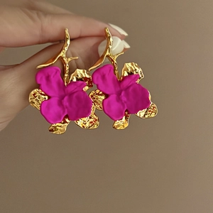 Chic floral stud earrings in matte magenta and hammered gold for a stylish bold look