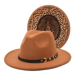 Detailed view of the wide brim fedora hat showing leopard print lining and leather band