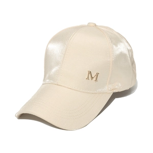 Fashionable satin silk baseball cap in champagne beige with gold M logo decoration
