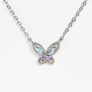Silver butterfly necklace featuring blue and purple gemstones with a long chain