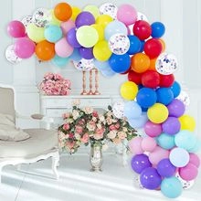 Macro shot of colorful balloon arch kit featuring pastel hues and sequin-filled balloons