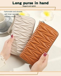 Detail of quilted wave pattern on large faux leather wristlet wallet for women