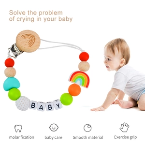 Rainbow silicone and beech wood baby pacifier clip with crochet beads and baby letters
