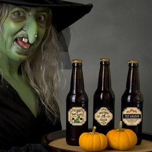 Close-up of vintage Halloween potion bottle stickers featuring poison and skull designs