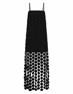 Detail of black midi dress featuring 3D polka dot appliques and a sheer hemline