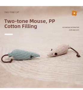 Detail of blue and pink knit mouse cat toys with soft PP cotton filling on beige carpet
