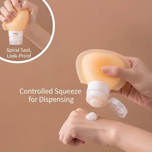 Silicone travel bottle for makeup remover showing squeezing action with leakproof seal