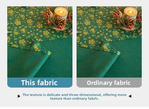 Detail of dark green Christmas fabric with gold foil snowflakes and embossed texture