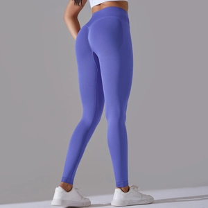 Detail view of electric blue high waist yoga leggings with seamless peach lift texture