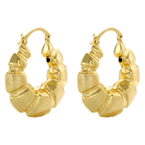 Detail of gold-plated hollow C-shape earrings with vintage ridged texture and U-shaped clasp