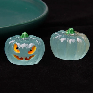 Detailed macro shot of translucent teal resin luminous pumpkins for Halloween decor