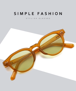 Detail view of vintage amber frames with stylish light yellow lenses and model specs