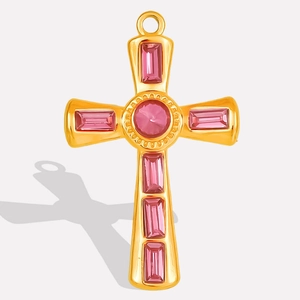 Detail of a gold stainless steel cross pendant featuring pink rectangular and round crystals