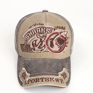 Detail of khaki baseball cap with SHARKS embroidery and distressed patchwork brim