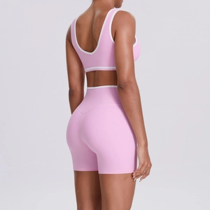 Close-up of pink yoga set back detail with U-shaped sports bra and high-waist shorts