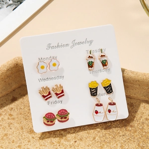 Close-up of 6-pair colorful food enamel stud earring set on a weekly fashion jewelry card