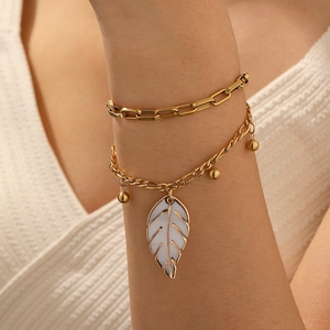 Double-layered gold-plated stainless steel chain bracelet with leaf and bead charms