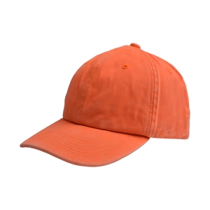 Detail of vibrant orange washed cotton baseball cap showing stitching and fabric texture