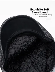Macro detail of quilted padded lining and cotton sweatband on plaid flat cap for winter