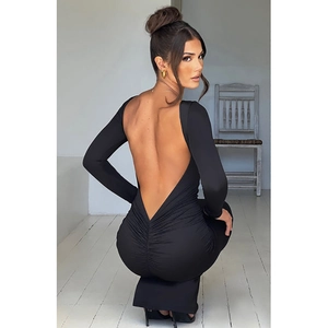 Detail view of the deep V backless design and ruched details on the black bodycon dress