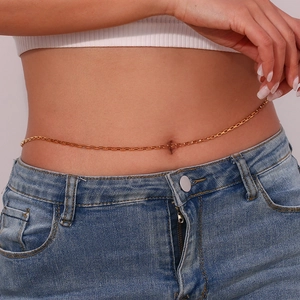 Close-up of a minimalist 18K gold plated waist chain worn by a model for a chic look