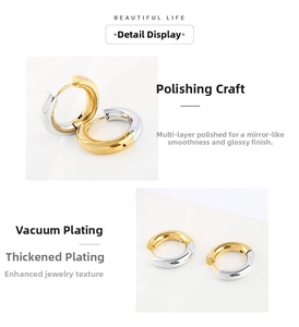 Detailed view of bicolor silver and gold hoop earrings with polished plating finish