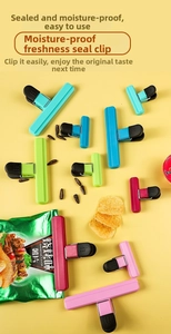 Close-up of colorful T-shape plastic food clips in various sizes for kitchen bag sealing