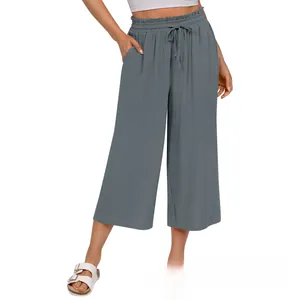 Detail view of high-waist grey linen culottes featuring elastic waist and adjustable drawstring