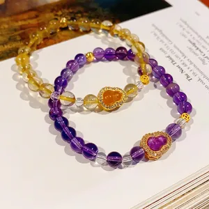Handcrafted citrine hulu flower bracelets set with gold gourd charms and crystal beads