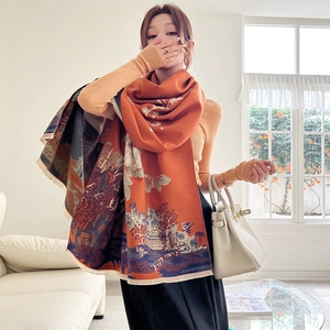 Close-up of vintage cashmere-like scarf showing vibrant orange blue landscape pattern