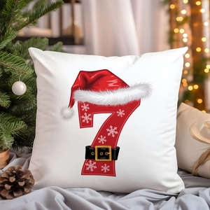 Close-up of Christmas pillowcase featuring red number 7 print on white fabric texture