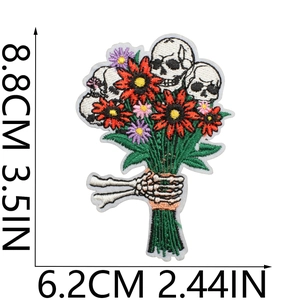 Detailed size view of skull and floral bouquet embroidery patch measuring 8.8x6.2 cm