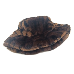 Detailed view of thick leopard print faux fur texture on a warm winter bucket hat