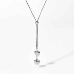 Polished silver stainless steel necklace with double 3D heart pendants and Y-shape chain