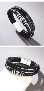 Detail of multi-layer black braided leather bracelet with magnetic buckle and metal beads