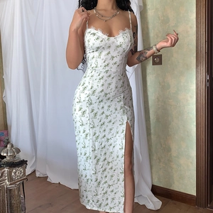 White floral spaghetti strap dress with lace trim and high side slit for a summer look