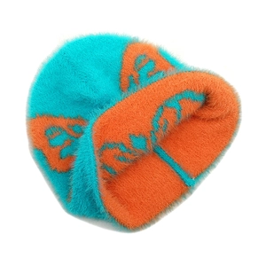 Close-up of contrast knit texture and abstract wavy patterns on the plush beanie hat