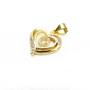 Detailed view of a gold heart-shaped zircon pendant featuring a sparkling double heart design