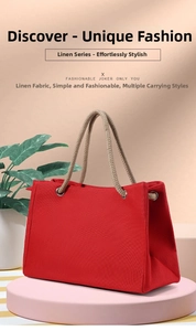 Detail of red linen trapezoid tote bag with woven rope handles on a stylish display